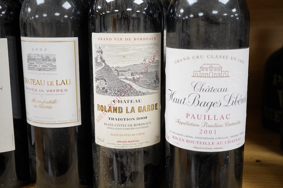 A bottle of Chateau Haut-Bages Liberal, 2001, and thirteen other bottles of red wine